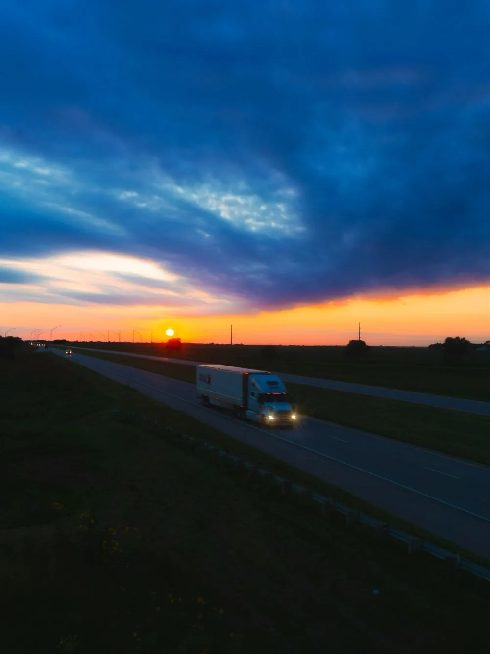 Lorry on a motorway at sunset