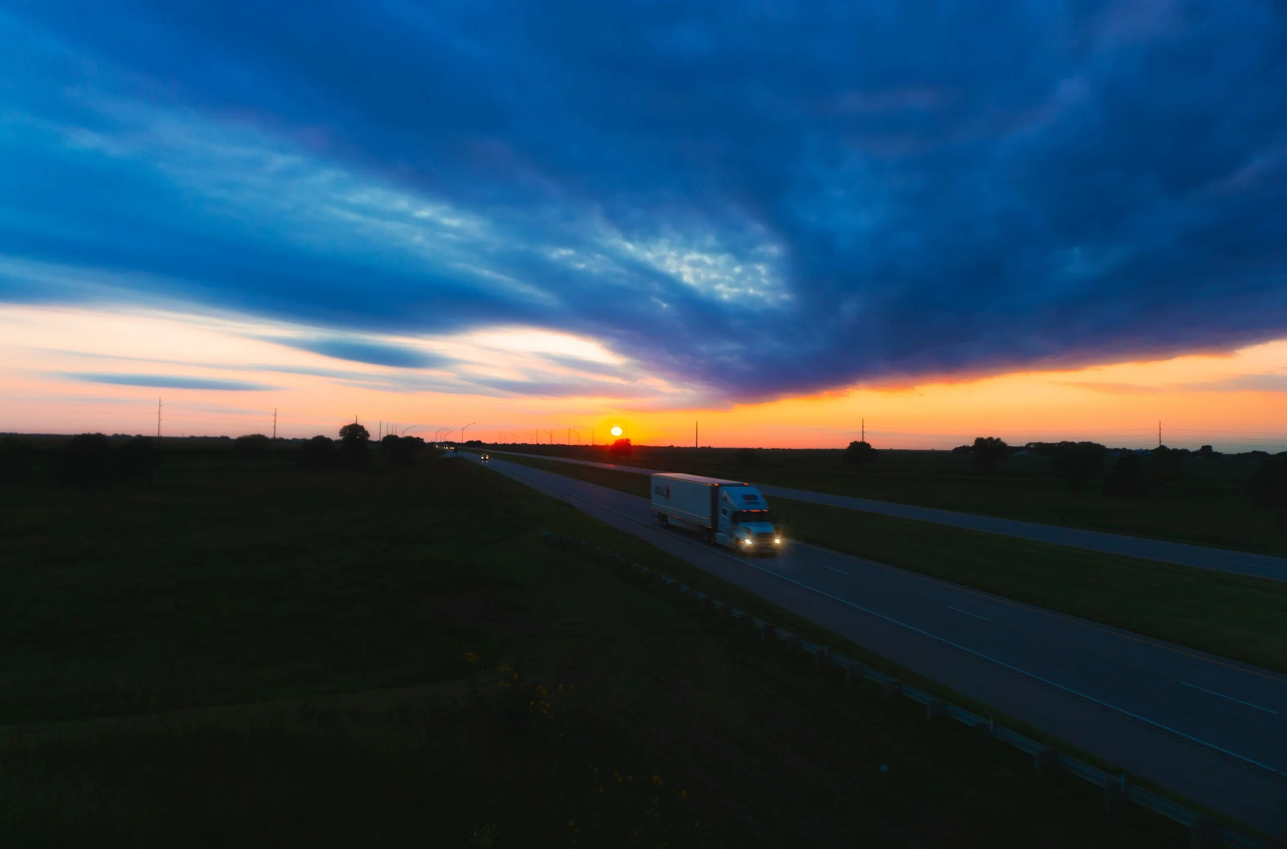 Lorry on a motorway at sunset
